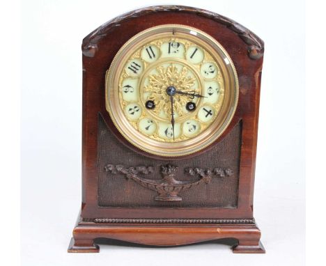 A late 19th century mahogany cased mantel clock of small proportions having a white enamel and gilt metal mounted Arabic circ