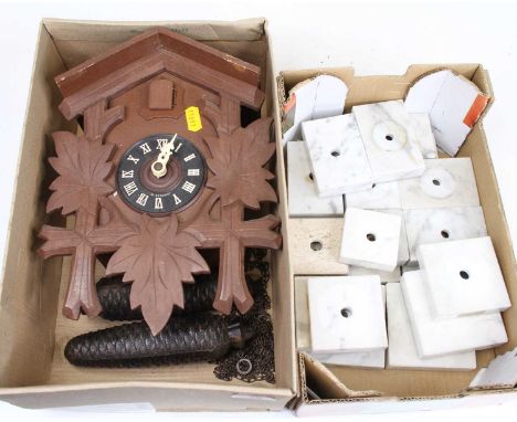 A Swiss cuckoo clock together with various marble clock mounts