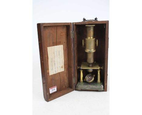 A 19th century brass monocular microscope, the stage above a shaped plinth, inscribed Harvey Reynolds &amp; Co., Leeds, house