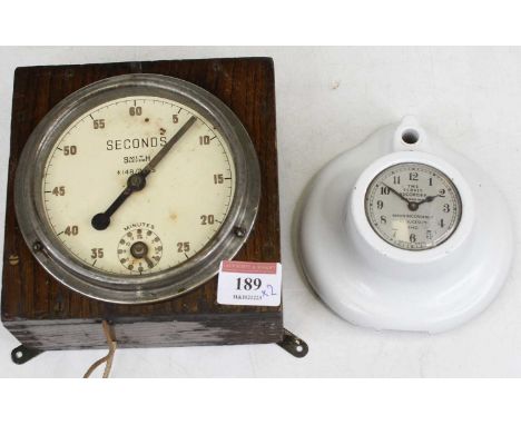 A Ministry of Defence issue Smith lever timing clock, w.14cm; together with The Service Recorder clock in metal mount (2)