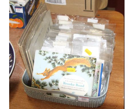 A collection of vintage tea and cigarette cards 
