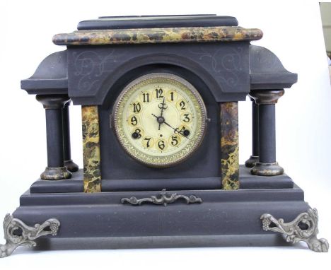 A late 19th century American ebonised and faux marble mantel clock, with further gilt metal mounts, having eight-day sprung m