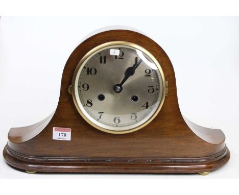 A circa 1920 walnut cased "Napoleon hat" mantel clock, having a signed silvered Arabic dial, and eight day brass movement, st