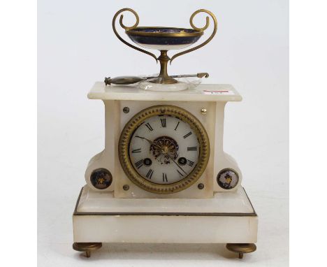 A late 19th century French alabaster mantel clock, the case surmounted with a pedestal bowl, and having enamelled border, the