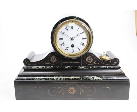 A late 19th century polished black slate drum head mantel clock, having a white enamel Roman dial, single winding hole for a 
