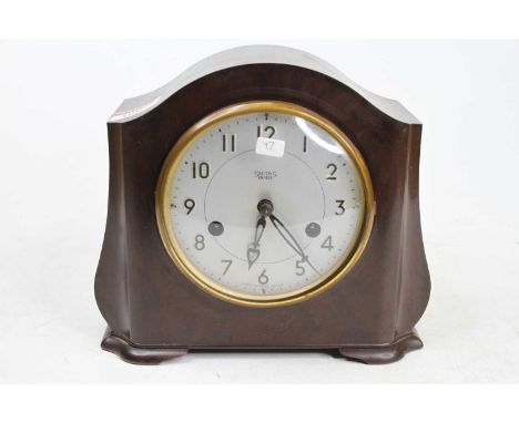 A Smiths Enfield bakelite cased mantel clock having a signed silver dial, twin winding holes for a brass eight-day movement s