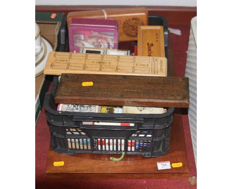 A collection of vintage boardgames to include dominoes and shove-ha'penny 