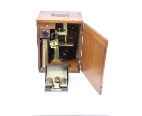 A 19th century brass monocular microscope, the mechanical stage above a Y-shaped foot, housed in a fitted mahogany case, insc