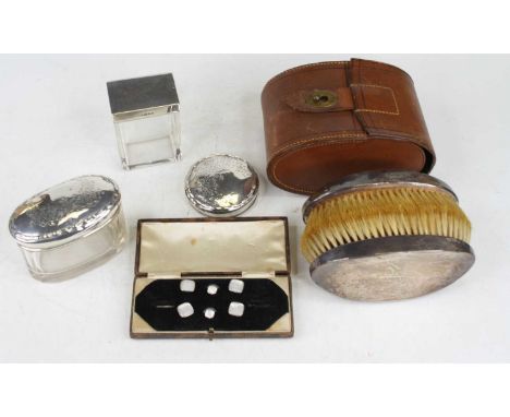 Two silver topped glass dressing table jars and one silver lid only, cased part set of mother of pearl faced collar studs, an