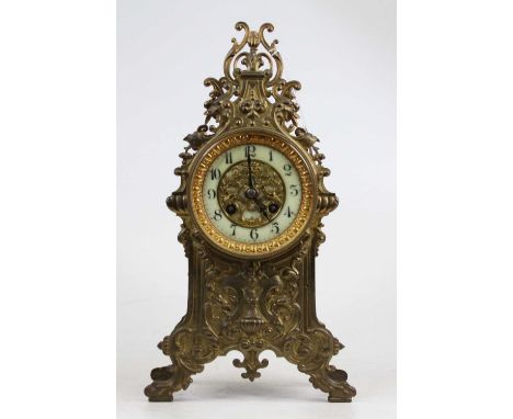 A 19th century French brass mantel clock, the enamel chapter ring showing Arabic numerals, having an 8 day movement, height 3