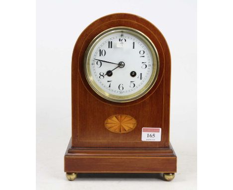 An Edwardian mahogany and inlaid dome top mantel clock having an unsigned white enamel Arabic dial, twin winding holes for a 
