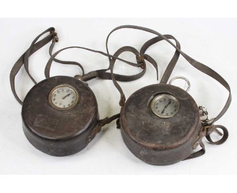 Two vintage pigeon racing clocks, each having a silvered dial showing Arabic numerals, and having a leather case, each 16cm (