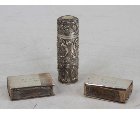 A late Victorian silver cased scent bottle by Samuel Morden &amp; Co, of cylindrical form with all-over C-scroll and flower h