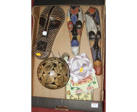 Miscellaneous items to include African carved wooden masks and an 18th century Delft manganese tile 