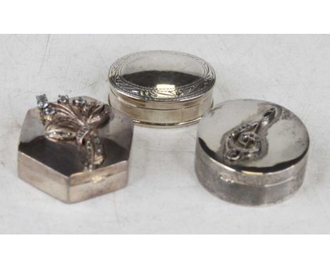 A modern white metal and marcasite set pill box, stamped 925; together with a modern similar silver example; and an oval silv