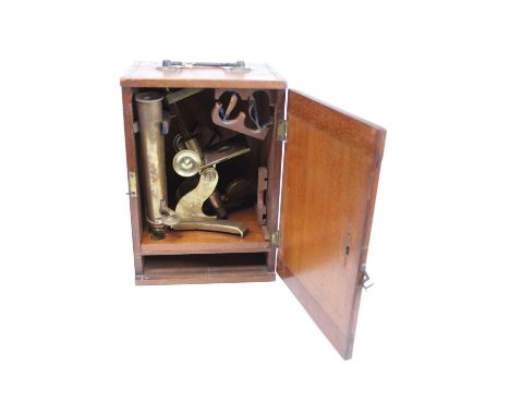 A 19th century brass monocular microscope, the mechanical stage above a Y-shaped foot, bearing presentation plaque dated Feb 