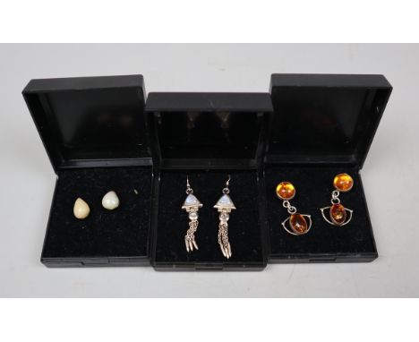 Collection of moonstone, opal and amber earrings on silver 