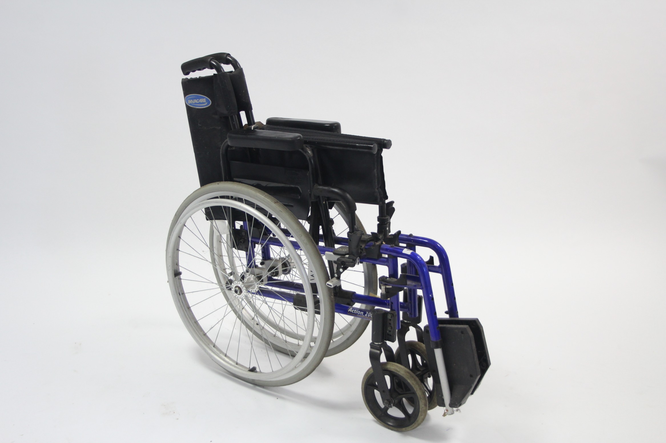 An Invacare "Action 2000" folding wheelchair.