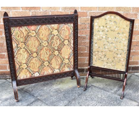 A CARVED OAK FIRESCREEN  inset with paisley embroidered panel, 79cm x 94cm overall; together  with a mahogany firescreen inse