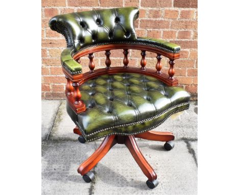 A GREEN LEATHER BUTTON UPHOLSTERED REVOLVING OFFICE CHAIR  on five prong base Condition Report : good condition, no issues Co