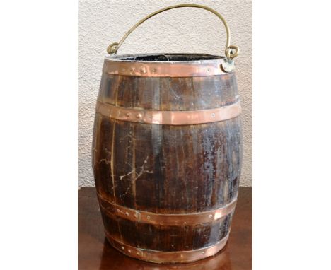 A COPPER BOUND OAK BARRELL STICK STAND  with brass swing handle and metal liner, 43cm high Condition Report : overall signs o