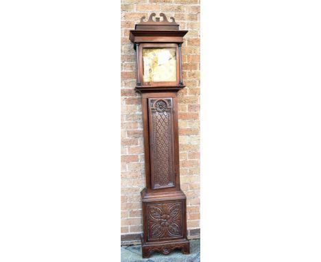 A CARVED OAK CASED 30 HOUR LONGCASE CLOCK  the brass dial engraved to centre with a winged figure and signed 'Edw. How Bishop