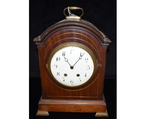 AN EDWARDIAN MAHOGANY CASED BRACKET CLOCK  the French Samuel Marti 8-day movement striking on a coiled gong, the 7' convex en