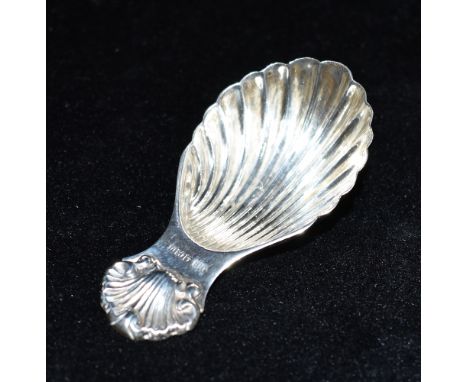 A SILVER CADDY SPOON  with shell bowl and handle, length 8.5cm, hallmarked for Birmingham, date letter U, possibly 1994.