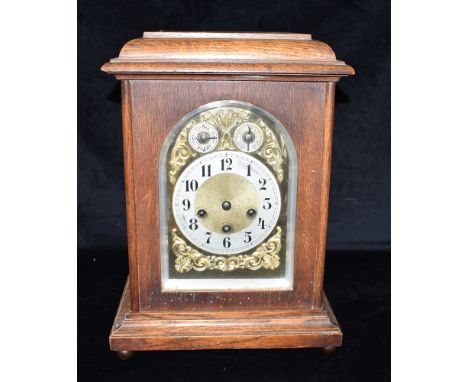 AN EDWARDIAN OAK CASED 8-DAY MANTLE CLOCK  the brass dial with subsidiary chime/silent and slow/fast dials, silvered chapter 