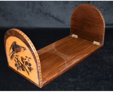 A TUNBRIDGE WARE BOOK SLIDE  the hinged domed ends depicting a pair of deer beneath tree to one end, a bird of prey to the ot