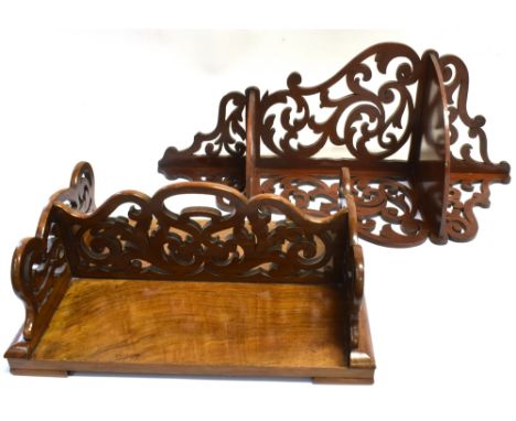 A WALNUT OPEN FRET CARVED FOLDING BOOK STAND  39cm wide; and a mahogany two tier corner shelf with open fret carved decoratio