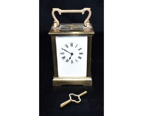 A BRASS CASED CARRIAGE CLOCK  the enamel dial with Roman numerals, 12.5cm high with carrying handle down Condition Report : n