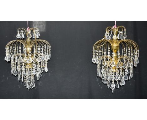 A PAIR OF CONTINENTAL THREE LIGHT CHANDELIERS  with four tiers of hanging glass drops, 60cm high Condition Report : good cond
