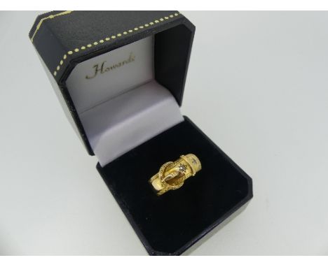 An 18ct yellow gold Buckle Ring, gypsy set  with two diamonds, Size R½, approx total weight 5.2g