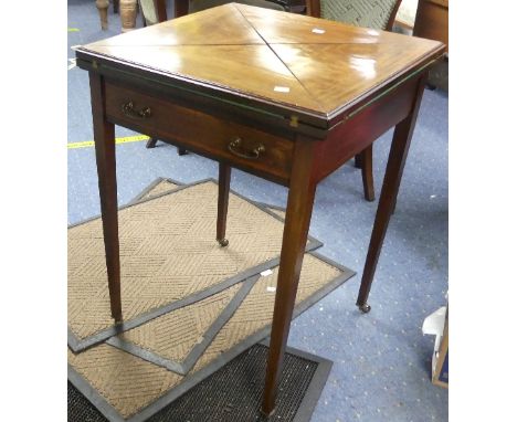 An Edwardian mahogany Envelope Card Table, the envelope movement top inlaid with boxwood and banded, enclosing a green felt b