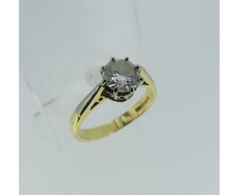 A diamond solitaire Ring, the brilliant cut stone approx. 1ct, mounted in yellow and white gold marked 750, Size M½.