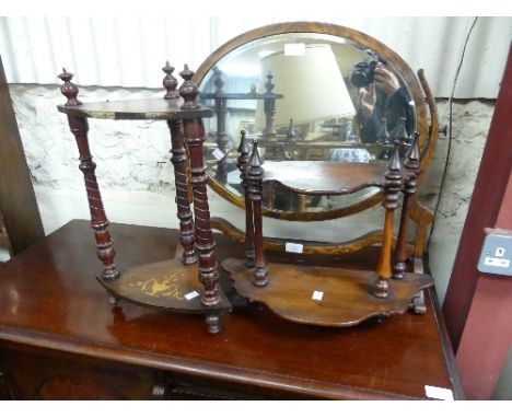 An oval oak swing Dressing Table Mirror, 23in (58.5cm) wide, one finial repaired, together with a small inlaid two tier hangi