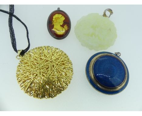 A circular carved jade Pendant, depicting a large bird in foliate, 2in (5cm) diameter, together with a silver and blue enamel