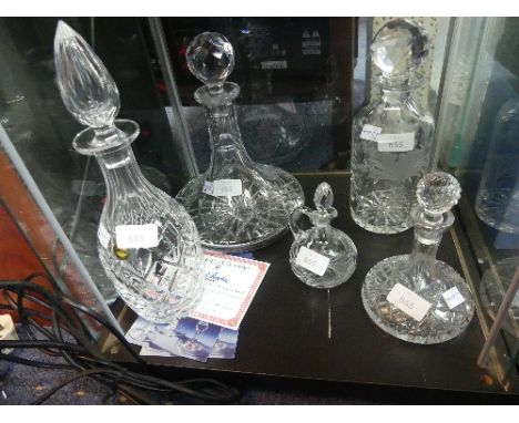 A collection of five Cut-glass Decanters, including a large Webb Corbett decanter, an Edinburgh Crystal Captain's Decanter, m