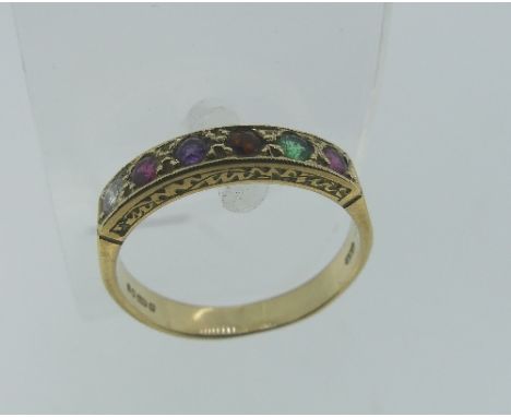 A 9ct yellow gold 'Regard' Ring, the circular facetted stones in an engraved gallery, Size  N.