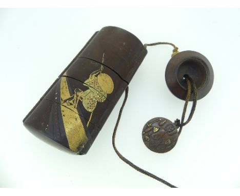 A Japanese Meiji Period five section lacquered Inro, decorated with a figure on a paddle boat, with carved bone ojime bead an