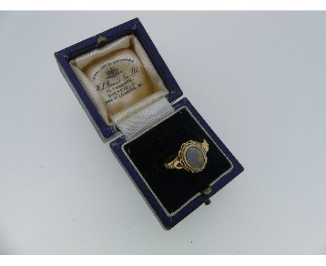 A 9ct yellow gold Opal Ring, the oval opal collect set in a shaped mount and shoulders, on a plain shank, Size N, in leather 