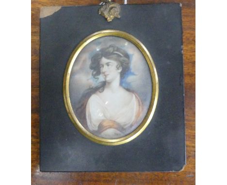 A 19th century portrait miniature of a classical youth, with long hair and wearing robes, oval, watercolour on ivory, 3½in x 