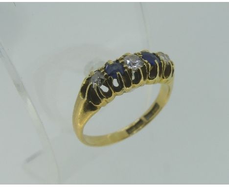 A small five stone sapphire and diamond Ring, all mounted in 18ct yellow gold, Size J.