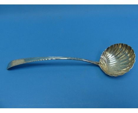 A George III Irish silver Soup Ladle, by Michael Keating, hallmarked Dublin, 1781, with scalloped bowl and bright cut handle,