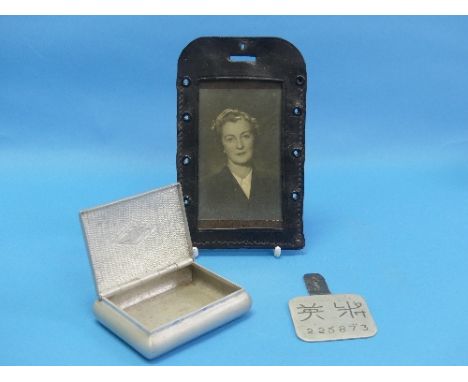 Japanese POW Interest; A metal 'dog-tag' with character marks and number, the reverse scratch engraved 'Lt Byers' on leather 