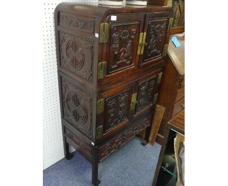 An early 20thC Chinese hardwood Cabinet, comprising a two tier double door cabinet of rounded rectangular shape, above a sing