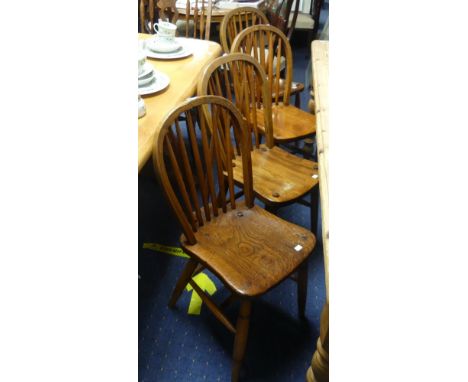 A set of four early 20thC  ash and elm Windsor-style stick back Chairs, including two stamped 'Goodearl Bros Ltd.', originall