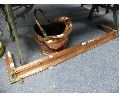 A copper Fire Fender, 46in (112cm) wide x 11in (28cm) deep x 3in (8cm) high, together with a copper Coal Scuttle (2) 