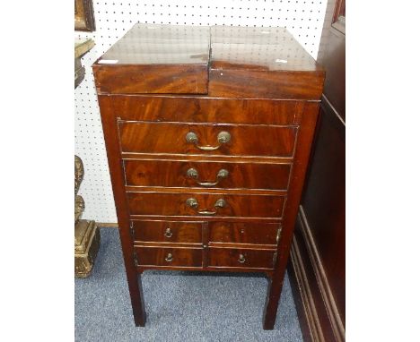 An early 19thC mahogany Gentleman's Dressing Stand, with folding top opening each side to reveal an interior fitted for jars 